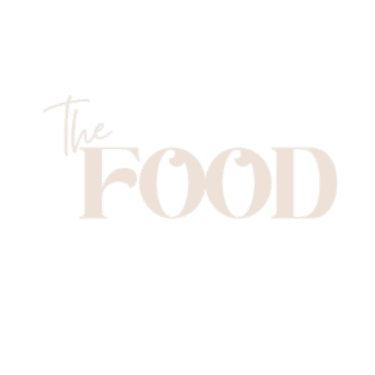 התמונה מציגה את המילים "the FOOD" באותיות גדולות בצבע בז' בהיר על רקע לבן חלק. המילה "the" מופיעה בגופן קטן וקורסיבי מעל האותיות הגדולות והמודגשות "FOOD".